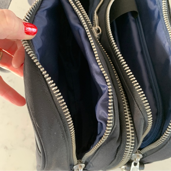 Black Travel Bag with Structured Design and Metal Feet - Picture 8 of 16